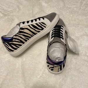 Kenneth Cole sneakers that are black and gray in a zebra print.